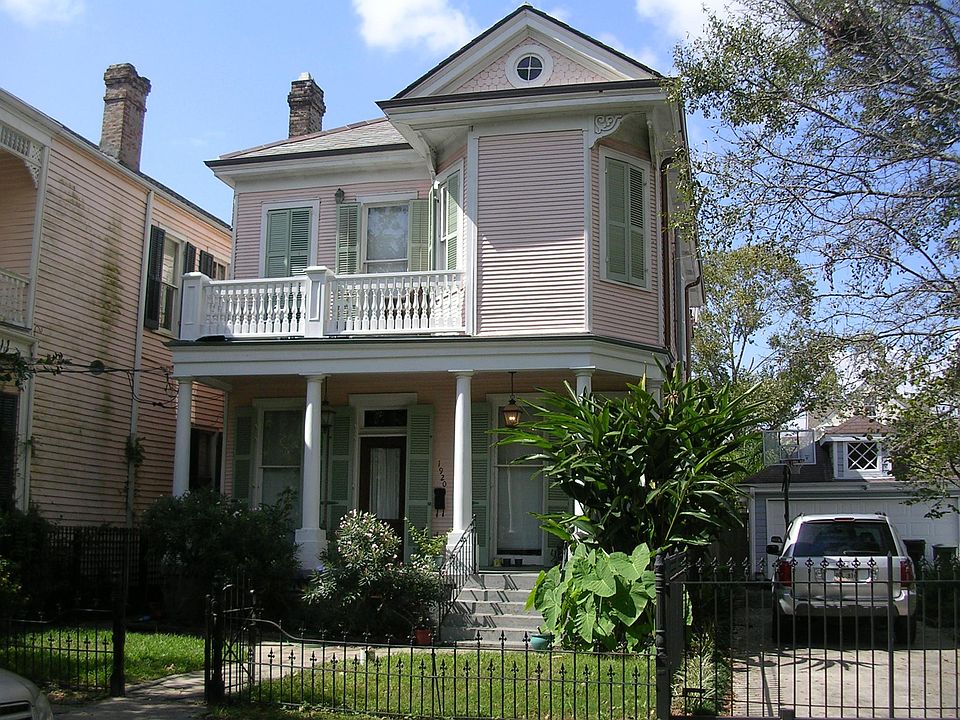 Milan Street view of 1890s Victorian, with as much preserved and restored as possible. Parking in front.