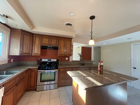 Huge kitchen with a big pantry and roll our trays in the bottom cabinets.