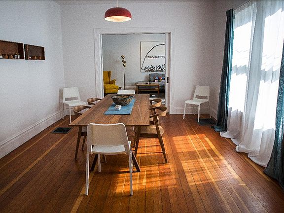 View of dining room. Large sliding pocket doors can separate living and dining rooms.