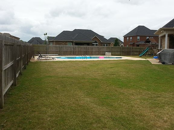 side of yard and pool