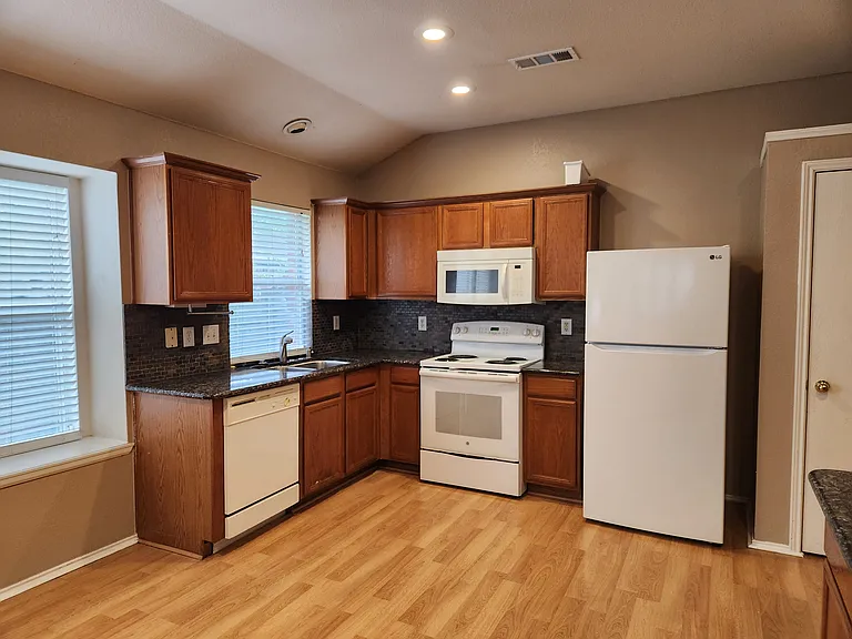 kitchen has appliances and pantry
