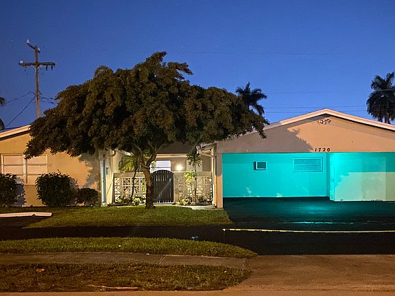 Night with large carport.