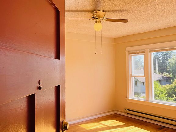 Welcoming entry, high ceilings, original hardwood floors