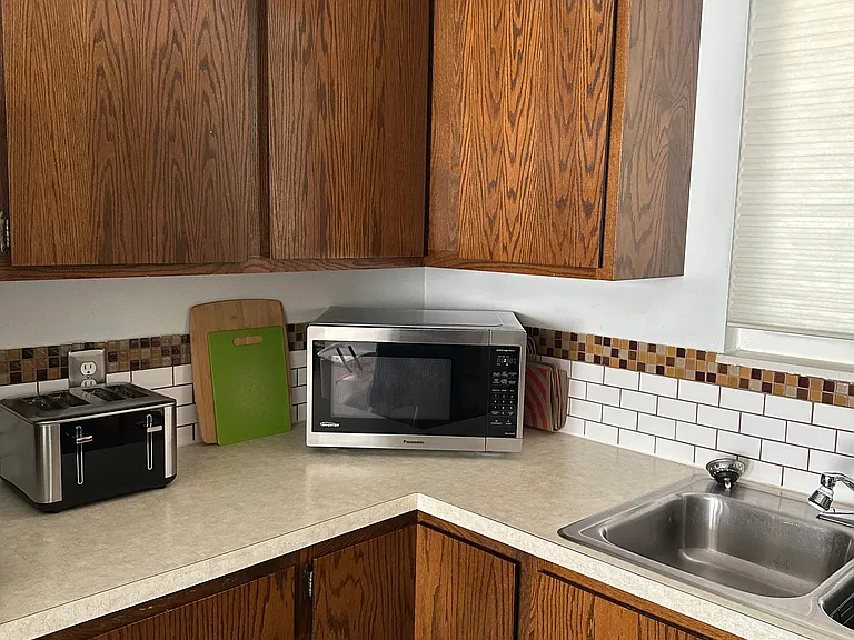 Fully stocked kitchen with cups, dishes, silverware, pots/pans, crockpot, blender and all the essentials!
