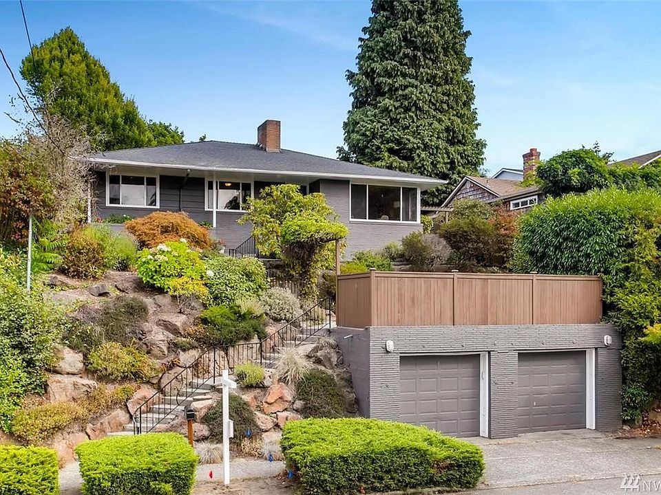 Located on quiet residential street with sunny western exposures and pleasing sound/mountain views just steps away from one of Seattle's premiere public waterfront parks: Lincoln Park.   Whether it's walking/running along the water for your morning workout or  an end of the day stroll to watch the sunset, you'll love living here.  Double car garage for off street parking and storage.