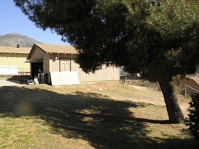 Side view of garage,trees