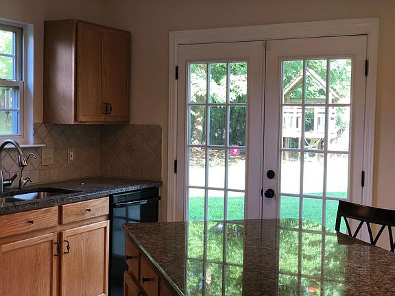 French doors open to the backyard from kitchen