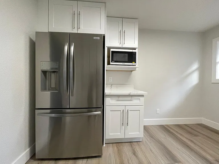 Unit 413 has refinished hardwood flooring rather than LVT like this unit 417