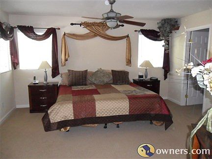 Master bedroom w/ wlak in closet and a regular closet