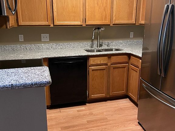 Kitchen with granite counter tops and newer appliances