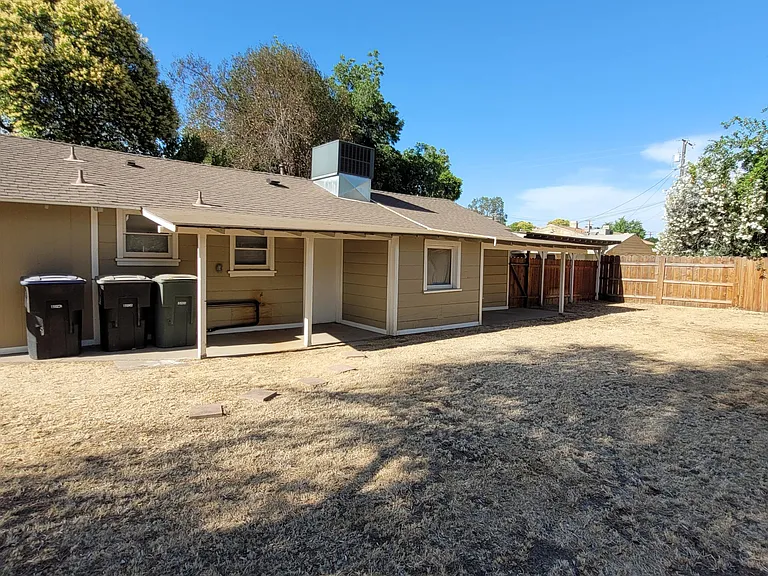 Exterior - covered porch with entry door to kitchen.
