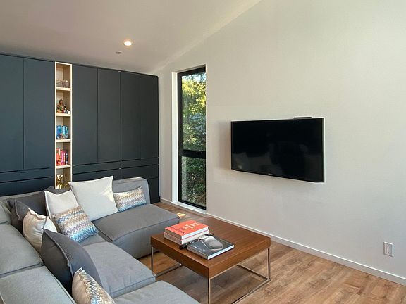 Living Room storage cabinets and TV wall.