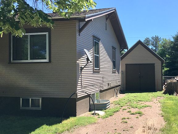 Gravel driveway to garage