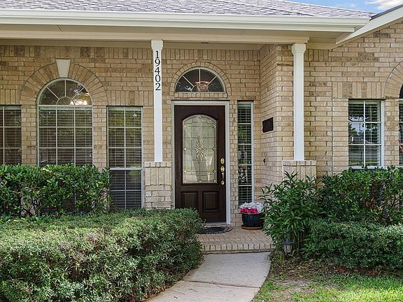 This cute covered porch is so welcoming!