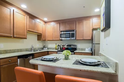 Stunning Kitchen with Stainless steel appliances, lots of counter space and cabinet storage, and a dining area. - Windsong