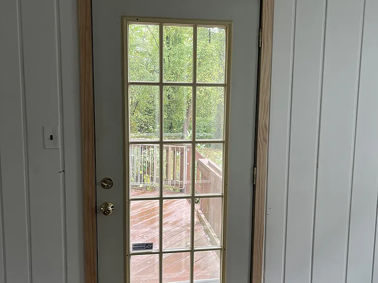 Living room door that provides direct access to the large deck.