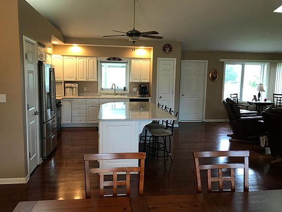 Large modern kitchen with island and breakfast bar.