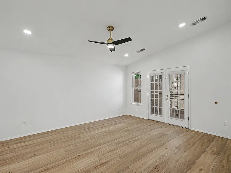 Primary bedroom with direct access to backyard.