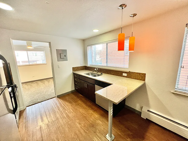Step into a stylish kitchen with modern lighting and ample natural light. Step into a stylish kitchen with modern lighting and ample natural light.