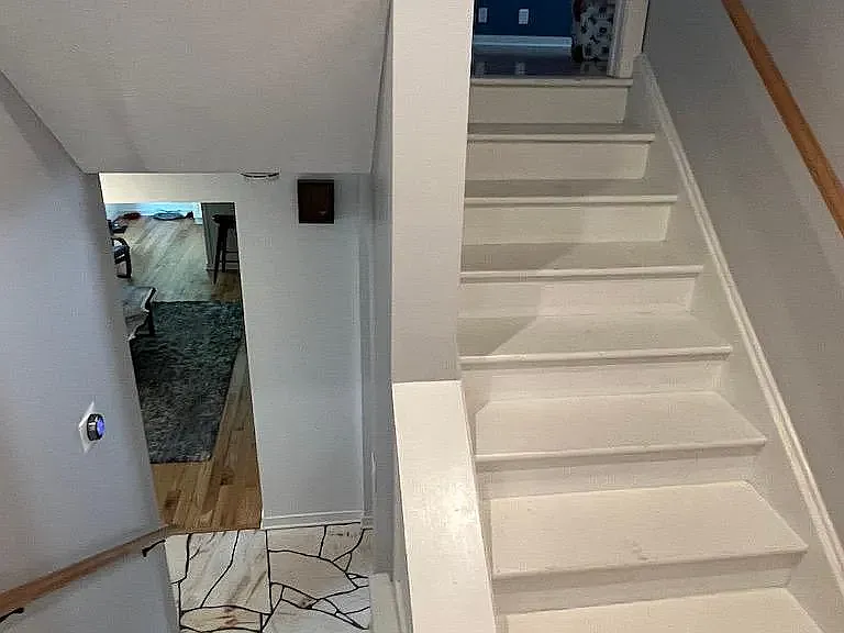 Stairs down to main level, stairs up to bedroom 4
