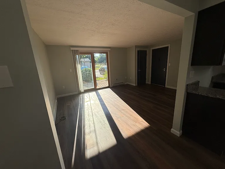 View from Kitchen to Living Room and Private Patio