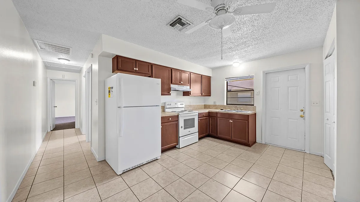 Kitchen with fridge, stove, oven and range hood - 1236 Josephine St