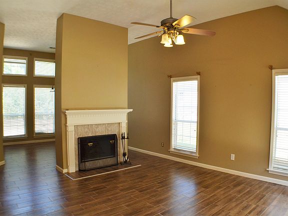 The Great Room has new tile flooring and is an open space concept that flows into the Dining Room.
