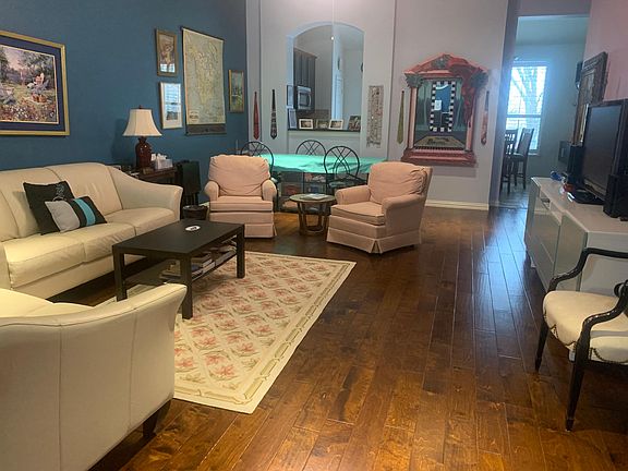 Living room with kitchen beyond