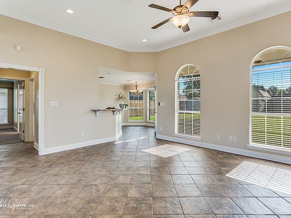 Living room, Hallway to Primary suite, Office, laundry room, 2nd entry to kitchen, Exit to back yard with views from living room