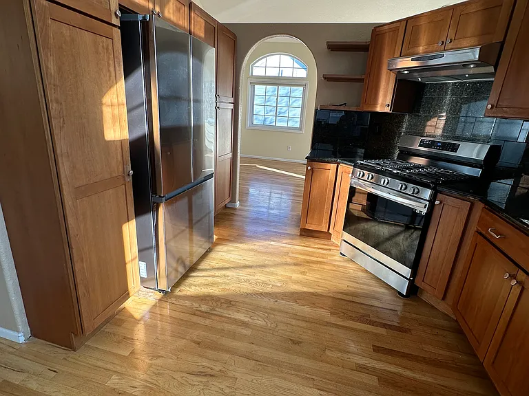 Kitchen looking into living room