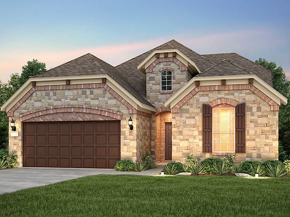 The Mooreville, a two-story home with 2-car cedar garage, shown with Home Exterior F