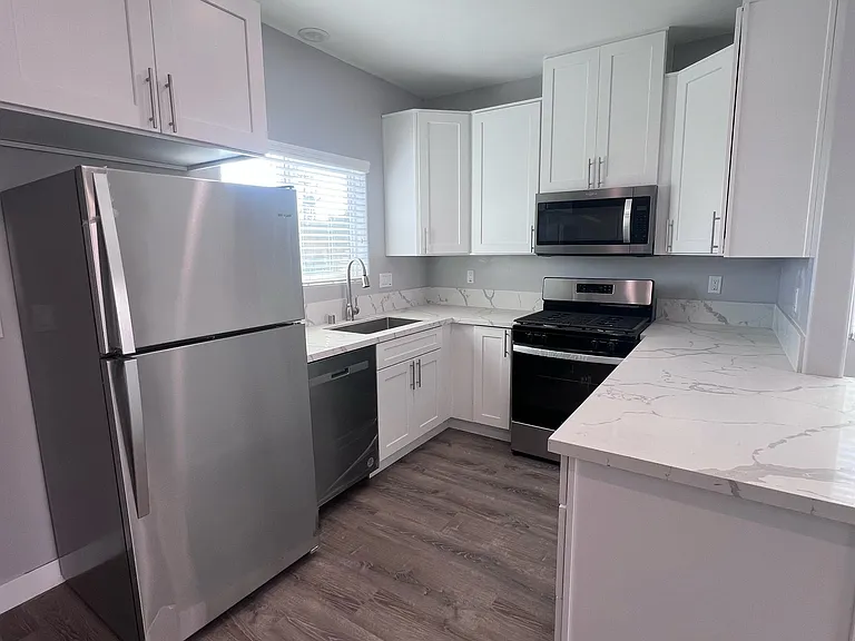 New stainless steel appliance and plenty of cabinets and counter space.