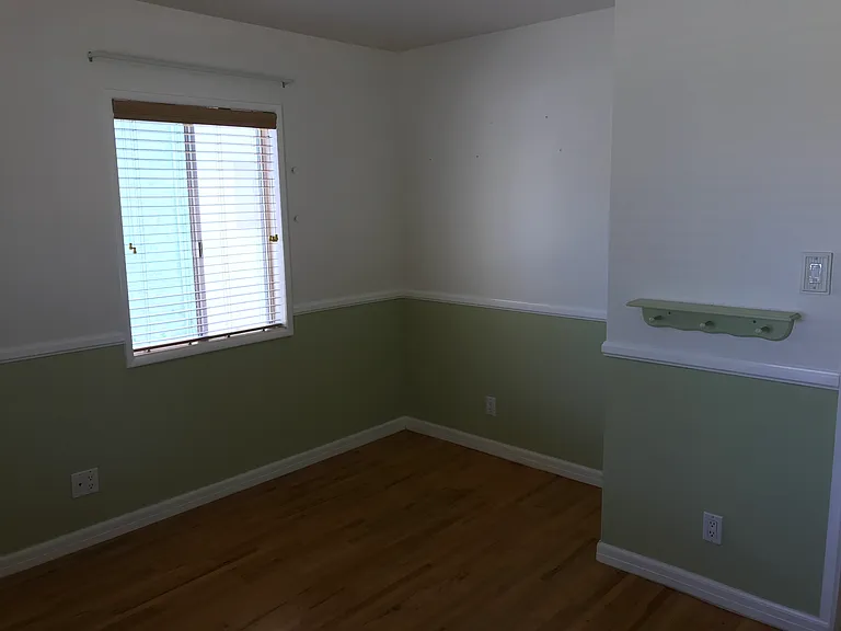 Another view of second bedroom with bonus space where closet used to be.