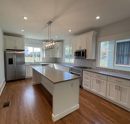 Remodeled kitchen with large island.