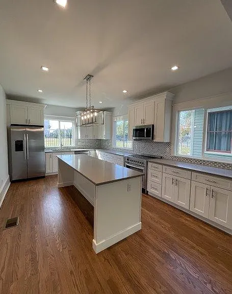 Remodeled kitchen with large island.