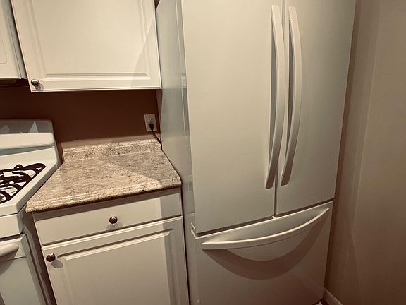 Painting still in progress. Updated kitchen. Refrigerator with bottom freezer and ice maker. gas range.