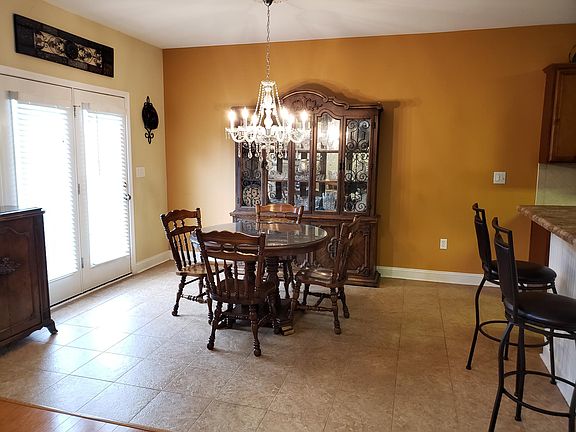 This open layout has its breakfast nook looking into the adjacent kitchen and great room with French doors to the patio.