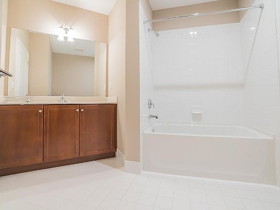 Secondary Bathroom Features Access to Both the Hallway and the Secondary Bedroom