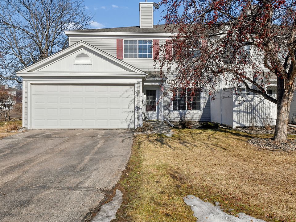 End unit townhouse with 2-car attached garage that faces south.