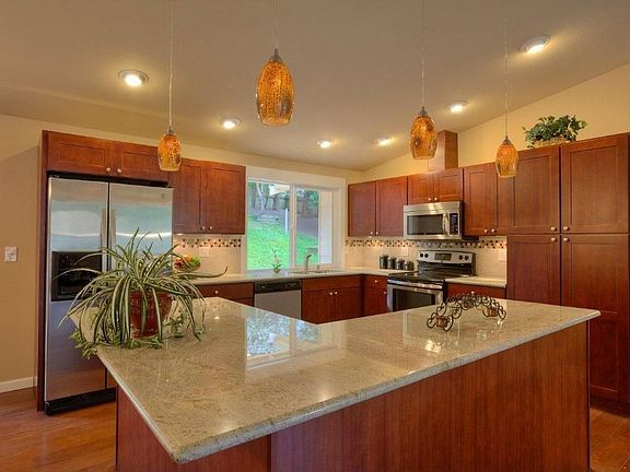 New cabinets with lighting, slab granite, big island with breakfast counter