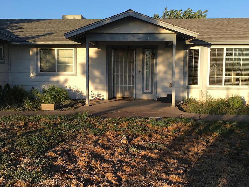 front of the house. The yard needs watered. There is a sprinker system for the front yard