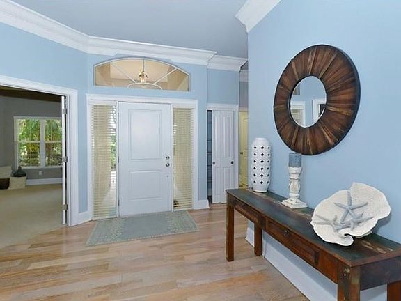 Entry with transom and side lights lets sunshine in.