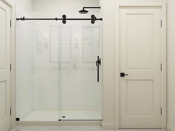 Primary bath with glass shower enclosure