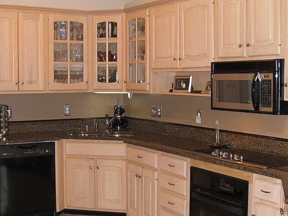 Kitchen with granite countertops, tile floor and new appliances