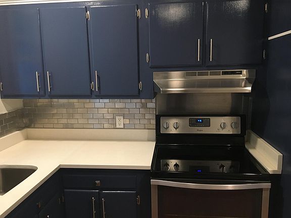 Stainless Steel Appliances, White Quartz Counter Tops, Real Wood Cabinets, Brush Nickel hardware