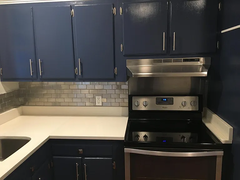 Stainless Steel Appliances, White Quartz Counter Tops, Real Wood Cabinets, Brush Nickel hardware
