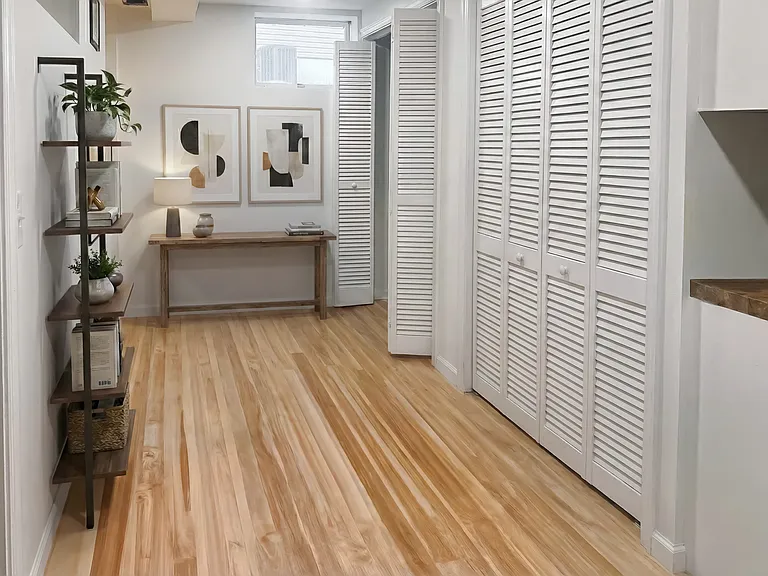 Flexible hallway nook staged as a small work-from-home or sitting area.
