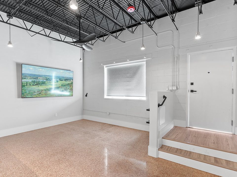 The pink terrazzo floors are a beautiful element preserved from the original building.
