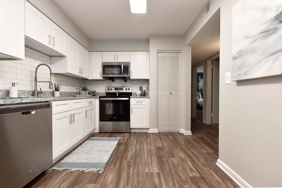 Wood Style Flooring and New Cabinetry, Granite Counters, Stainless Appliances