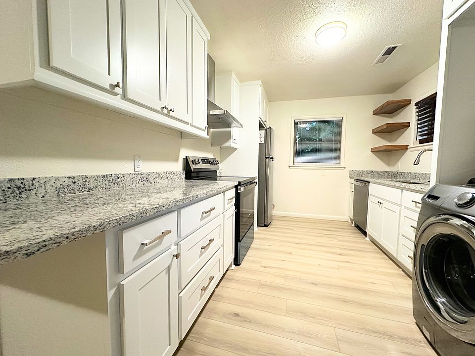 Brand new custom kitchen cabinets, granite counter tops, appliances, fixtures, and new flooring throughout.